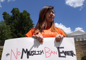 Woman holding No Muslim Ban sign